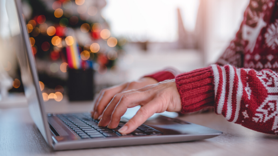 Christmas, social media, woman on laptop