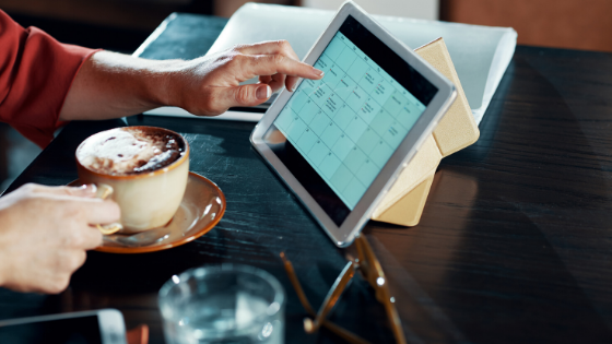 Calendar on tablet; coffee shop