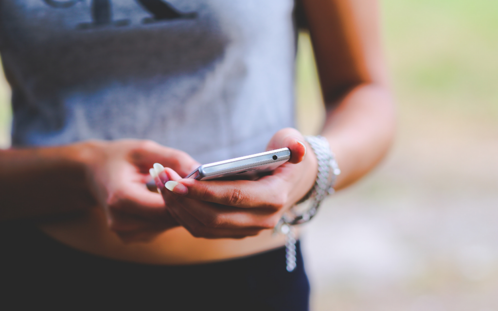 Woman holding mobile phone